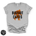 Bigfoot Exists Tee | Funny Cryptid Graphic T-Shirt (BLACK DESIGN)